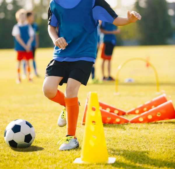Boy Soccer Player In Training Drill. Young Soccer Players at Practice Session