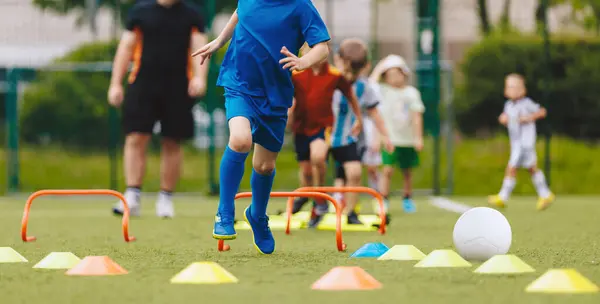 stock image Kids in physical education training. Children play sports drill on training equipment