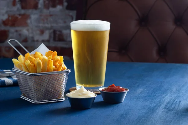 Golden French Fries Wire Basket Pilsner Lager Beer Ketchup Mayonnaise Stock Photo
