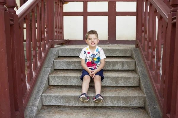 Four Year Old Boy Sitting Gesturing Alone —  Fotos de Stock