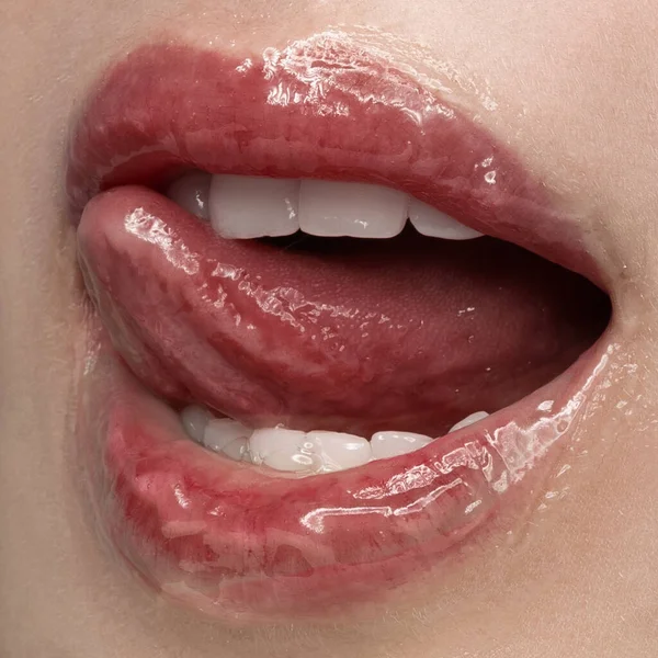 Honey and sweet sexy lips. Closeup sensual womens open mouth with sticking out tongue. Dental health, beauty, fashion, style concept. Poster for ad, design