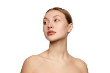 Half-length portrait of young beautiful girl without makeup on face. Model with bare shoulders. Concept of purity, skin care, beauty, spa, anti-aging procedures. Copy space for ad