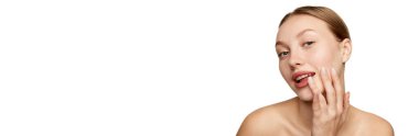 Half-length portrait of young beautiful girl without makeup on face. Model with bare shoulders. Concept of purity, skin care, beauty, spa, anti-aging procedures. Banner with copy space for text