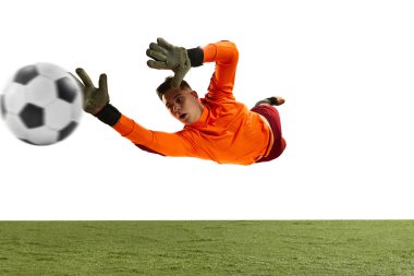 Dynamic portrait of professional soccer goalkeeper in sports uniform jumping and catching football ball isolated over white background. Concept of sport, action, motion, goals. Wide angle view