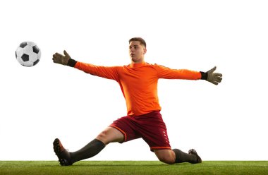 Professional soccer football goalkeeper in action, motion isolated over white studio background. Concept of sport, achievement, competition, goals. Copy space for ad