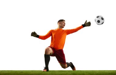 Young caucasian football player, male soccer goalkeeper wearing red football kit isolated over white background. Sport, hobby, success concept. Copy space for ad