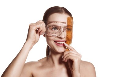 Making beauty, modifying face to make non-surgical or surgical correction, plastic surgery. correction of asymmetry. Young woman, female patient isolated on white studio background. Concept of lifting