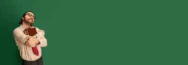 Bookkeeper. Portrait of retro mature man with moustache and beard in eyeglasses posing in vintage fashion clothes over dark green background. Concept of retro style, emotions, business, work