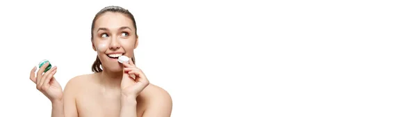 stock image Happy beautiful young woman with smooth clean face skin posing over white background. Concept of spa, beauty, skincare, cosmetology. Model with bared shoulders. Banner with copyspace for ad, text