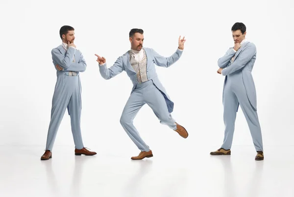 Lets dance. Shot of three man wearing elegant outfit entertaining together over white studio background. Concept of historical remake, comparison of eras, retro, vintage, emotions, ad