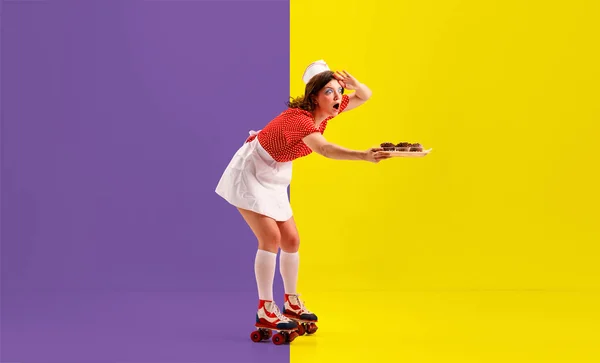 Pin Up style portrait of beautiful young girl, retro cater waiter wearing 70s, 80s fashion style uniform and rollers isolated on bright vivid colors background. Trash pop art Express delivery, ad