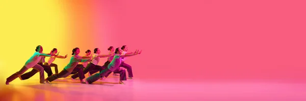 ネオンの光の中でピンクと黄色のグラデーションの背景で音楽のビートに移動若い愛らしい女の子のダンスチームとバナー モダンダンス 創造性のコンセプト アート — ストック写真