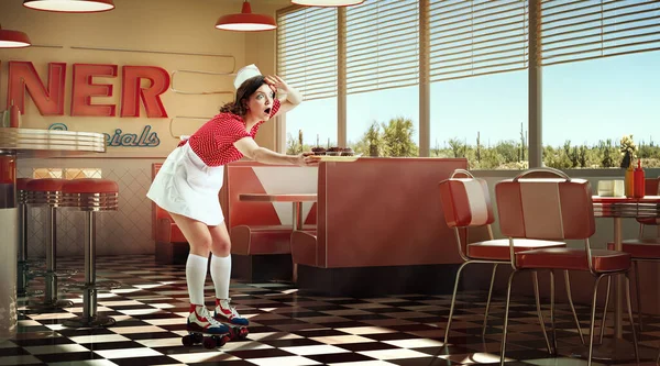 stock image Young adorable girl, waitress in retro style clothes and rollers holding food tray and delivering to clients over 3D model of diner interior, restaurant. Vintage cafe service. Concept of food, art, ad