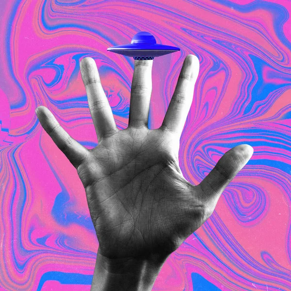 Contemporary art collage of human palm, hand with ufo on middle finger over multicolored background. Concept of business, career, work, job, surrealism, inspiration, creative ideas, ad