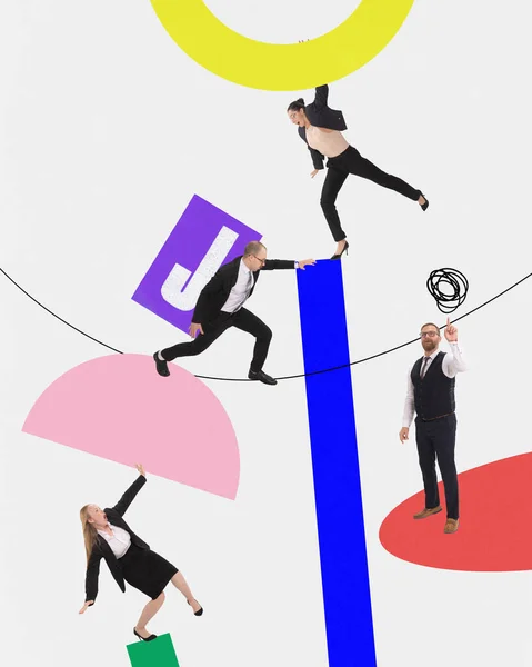 Contemporary art collage. Young successful business people in formal, casual suit working in team and build new project from geometric figures and letter J. Business, career, startup concept