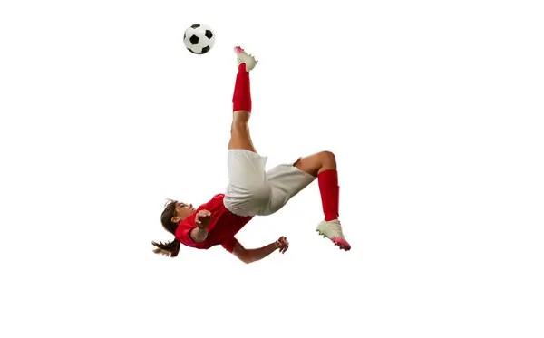 Jovencita Competitiva Futbolista Movimiento Pateando Pelota Cayendo Aislada Sobre Fondo — Foto de Stock