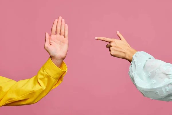 Two hands showing palm, index finger, pointing isolated on pastel pink color background. Sign of partnership, friendship, deal, nonverbal, communication. Feelings and emotions concept. Poster. Ad