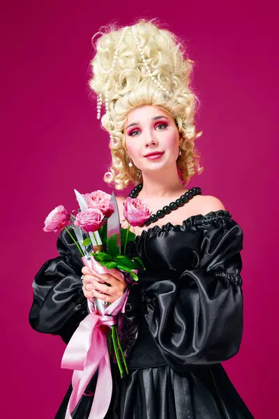hidden revenge. Portrait of queen young lady holding bunch of flowers with sharp knives against magenta background. Concept of human emotions, comparison of eras, love, romantic, style, fashion, ad.