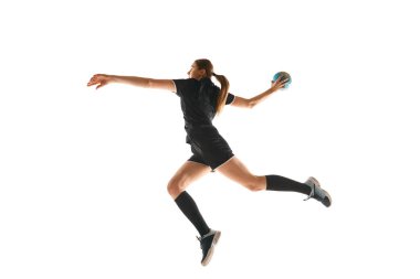 Talented handball player, female sportsman practicing techniques, capturing intensity of sport against white studio background. Concept of hobby, movement, dynamic, active lifestyle, championship.