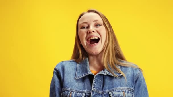 Surprise Young Emotional Woman Denim Jacket Looking Camera Yellow Studio — Stock Video
