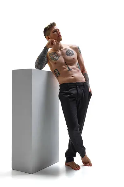 Barefoot Tattooed Young Man Leaning Gray Block Posing Deep Thought Stock Photo