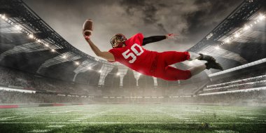 Oyuncu, enerjik seyircilerle dolu bir stadyumun arka planına doğru topu yakalamak için uzanırken, tamamen gerilmiş bir şekilde öne doğru dalıyor. Stadyumun 3 boyutlu görüntüsü. Spor, turnuva, yarışma, oyun kavramı