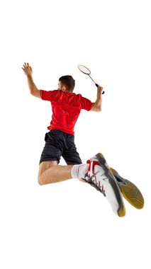 Badminton 'daki güçlü zıplama atışının arka plan fotoğrafı atlet havaya sıçrıyor ve kritik oyun anında havanın gücünü gösteriyor. Hareket kavramı, profesyonel spor, rekabet. Ad