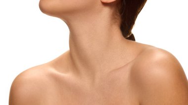 Young woman tilting head back slightly with relaxed posture highlighting neckline against white studio background. Concept of natural beauty, self-care, anti aging procedures, lifting, wellness. clipart