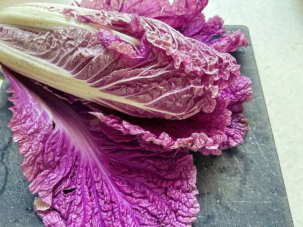 purple Chinese cabbage, vegetable, purple vegetable on a wooden board, washed Chinese cabbage cabbage, vegetable, purple vegetable on a wooden board, washed Chinese cabbage
