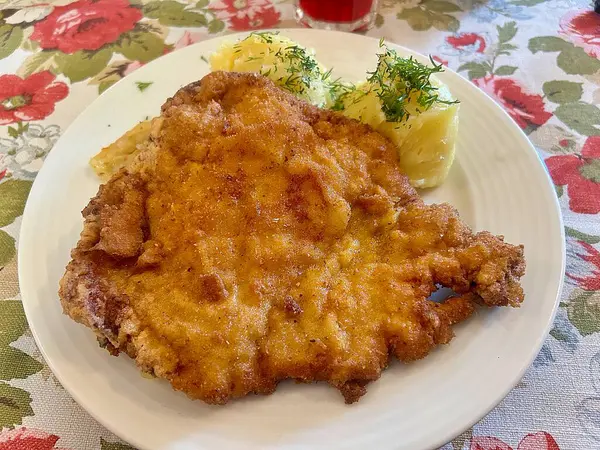 large pork chop, breading on the cutlet, mashed potatoes, dinner dish, typical Polish dinner