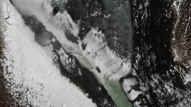 Huge snowy waterfall drone view. High quality 4k footage