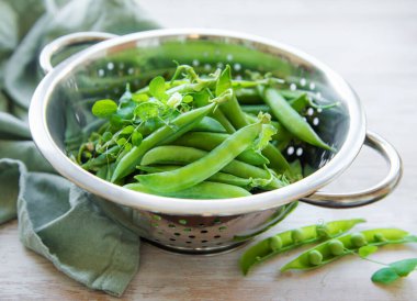 Young fresh juicy pods of green peas. Healthy organic food. 