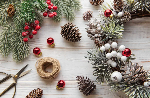 stock image  Making christmas wreath, Prepare for Christmas, creative craft wreath. White old wooden background