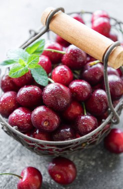 Fresh red cherries fruit  on a concrete background