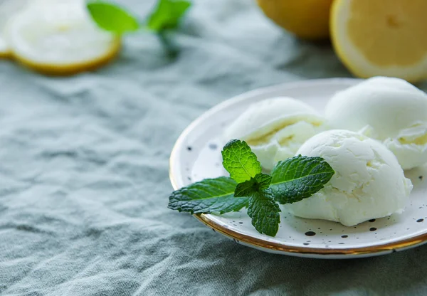 Homemade citrus lemon ice cream with mint on plate