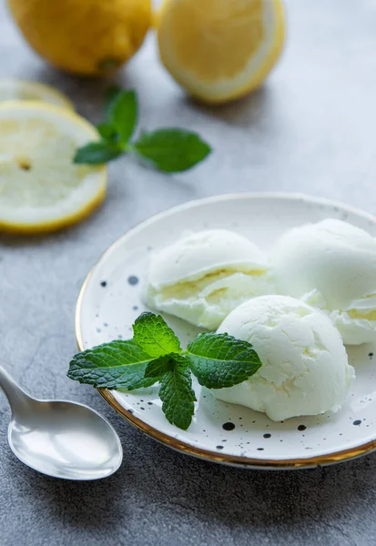 Homemade citrus lemon ice cream with mint on plate