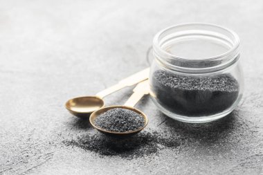 Jar of Hawaiian black  lava sea salt .  Healthy food concept. Speciality salt.