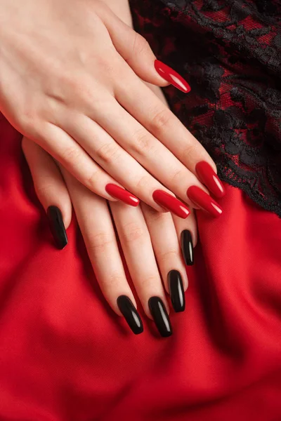 Hands Young Girl Black Red Manicure Nails Red Background Black – stockfoto
