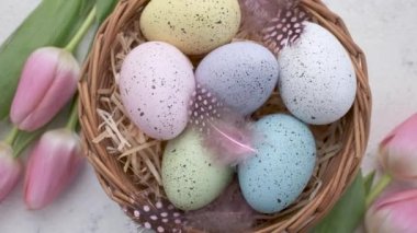 Colorful Easter eggs  rotation. Happy Easter background. Top view Rotating Of Colorful Easter Eggs in a basket