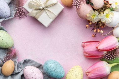 Happy easter holiday greeting card. Bouquet of pink tulips and Easter egg on pink background. Space for text