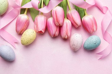 Happy easter holiday greeting card. Bouquet of pink tulips and Easter egg on pink background. Space for text