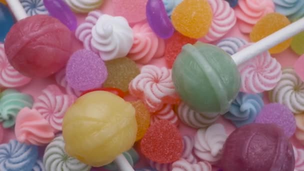 사탕에 롤리팝을 섞어서 회전시켜 디저트 휴일이나 아이들의 생일을 — 비디오