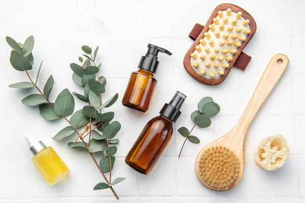 stock image Spa treatment concept. natural spa cosmetics products with eucalyptus oil,, massage brush, eucalyptus leaf. Massage and spa concept