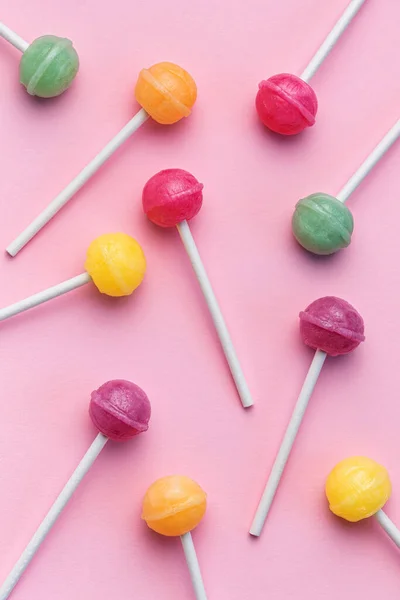 Colorful Sweet Lollipops Pink Background Flat Lay Top View — kuvapankkivalokuva