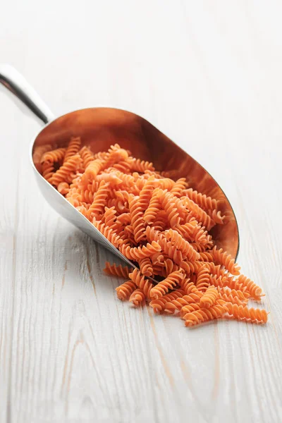 Red Lentil Fusilli Pasta Wooden Background Scoop Raw Pasta Red — Stock Fotó