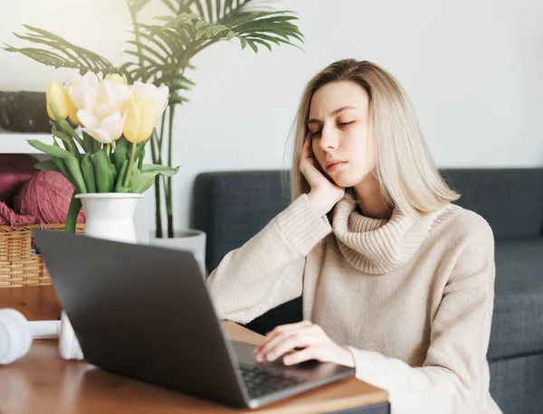 stock image Stressed business woman working from home on laptop looking worried and tired 