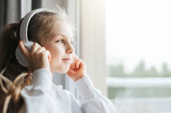 Little Girl Headphones Indoors Home Sitting Window Sill Listening Music — Stock Photo, Image