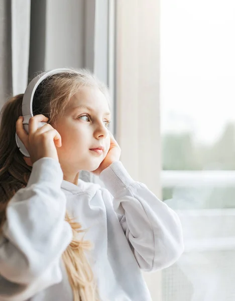 Little girl with headphones hotsell