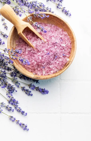 Lavender spa. Lavender salt and fresh lavender on a white tile background.