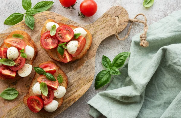 Bruschetta Fresh Tomatoes Basil Mozzarella Cheese Wooden Board — Stock Photo, Image